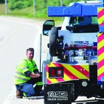 AAA worker providing roadside assistance