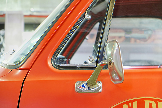 A vintage vehicle with vent windows, one of the features that no longer exist in cars.