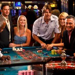 cruise ship casinos - group of guests playing craps