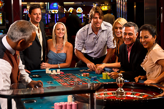 cruise ship casinos - group of guests playing craps