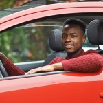 car insurance for teens - young teenager in the driver seat
