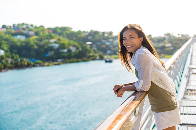 woman smiling aboard a river cruise ship