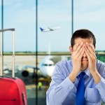 trip cancellation insurance - man is stressed at the airport