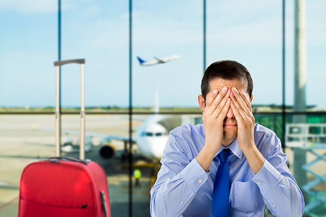 trip cancellation insurance - man is stressed at the airport