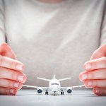 flight insurance - man with a model airplane