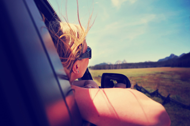 woman looking out the passenger side window
