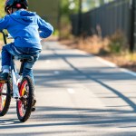 young kid riding a bike