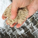 mineral salt in hand used to melt snow