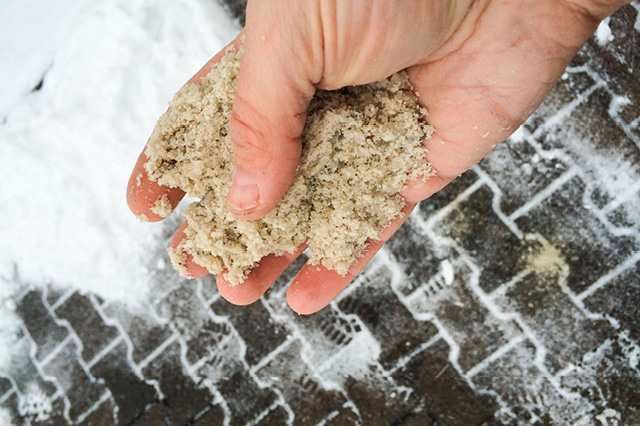 mineral salt in hand used to melt snow