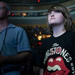 Teen wears a Rolling Stones t-shirt.