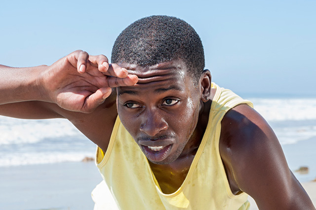 A man who appears to be exercising at the beach.