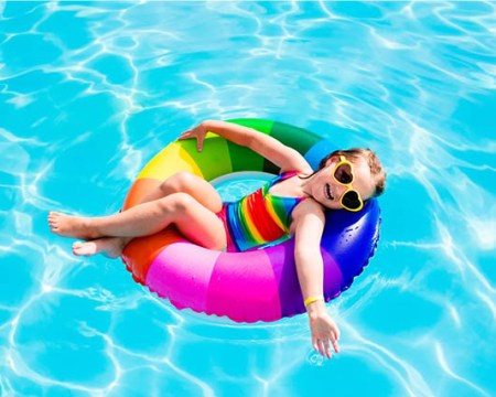 child in pool tube float