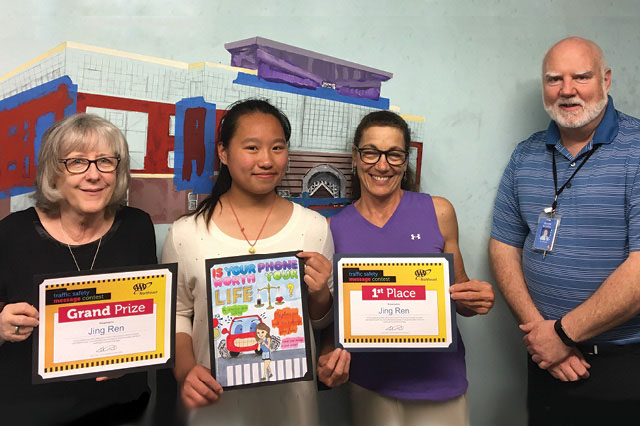 Grand-prize poster winner Jing Ren, second from left, with Beebe School interim principal Barbara O’Brien, art teacher Andrea Pellegrino and assistant principal Kevin Kilbride.