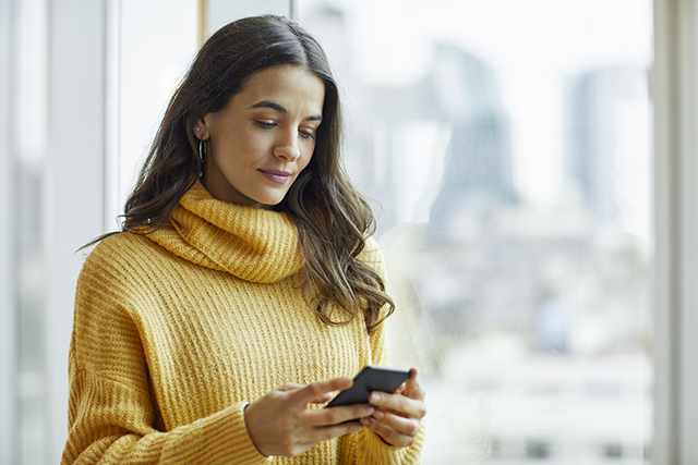 woman using phone for good