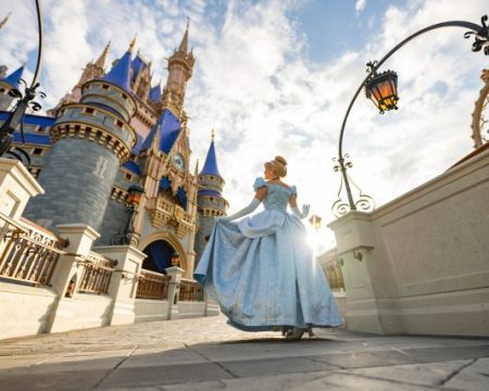 Cinderella poses in front of Cinderella Castle inside Magic Kingdom Park at Walt Disney World Resort in Lake Buena Vista, Fla. (Matt Stroshane, Photographer)