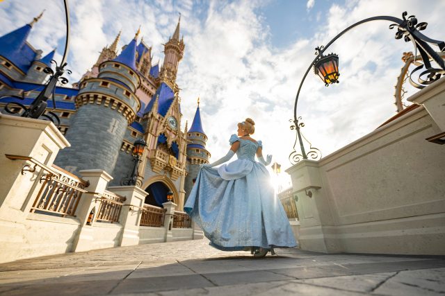 Cinderella poses in front of Cinderella Castle inside Magic Kingdom Park at Walt Disney World Resort in Lake Buena Vista, Fla. (Matt Stroshane, Photographer)