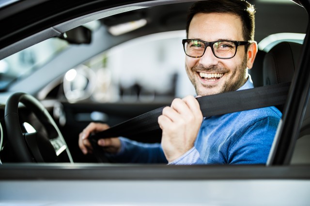 renting a car - smiling man in car