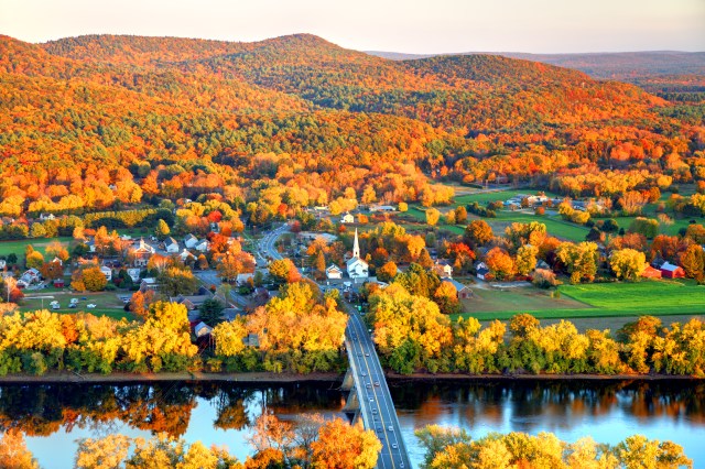 Connecticut River winding through the Poineer valley region of Massachusetts. Photo taken from a scenic viewpoint on Sugurloaf Mountain in Sunderland  at dusk. The Pioneer Valley is known for its scenery and as a vacation destination and its beautiful fall foliage ranks with the best in New England