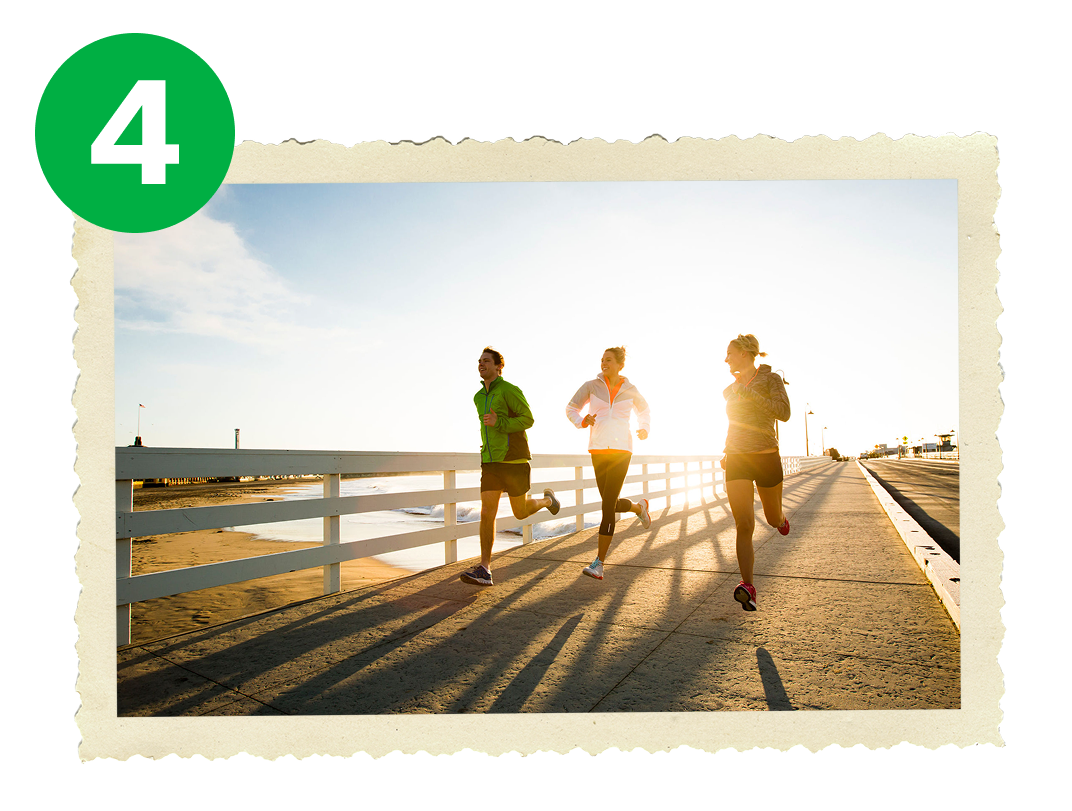 People jogging on boardwalk