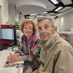 Karen and Simon Landsman finalizing trip plans at the Garden City, New York, branch.